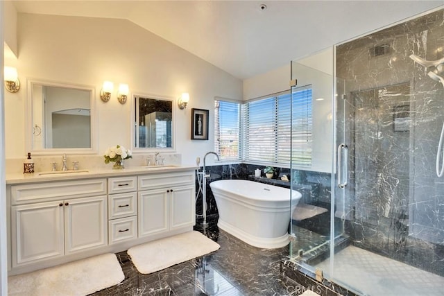 bathroom featuring lofted ceiling, vanity, and separate shower and tub