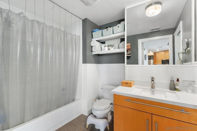 full bathroom featuring vanity, shower / tub combo, tile patterned floors, and toilet