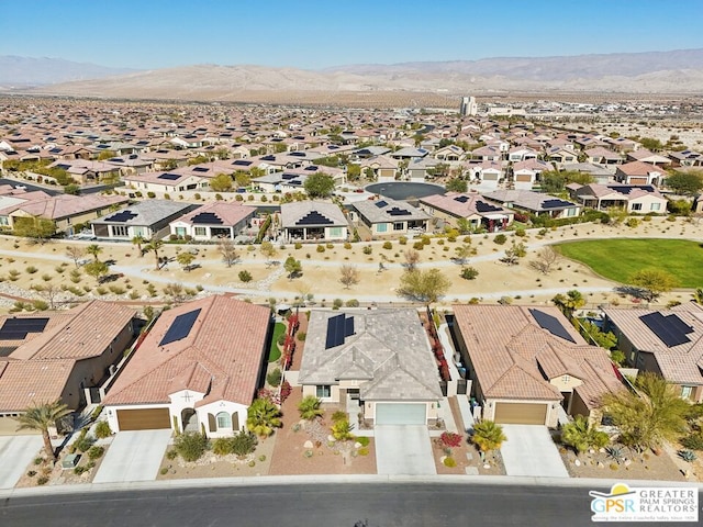 birds eye view of property with a mountain view