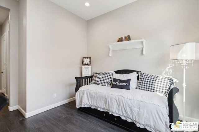 bedroom featuring dark hardwood / wood-style flooring