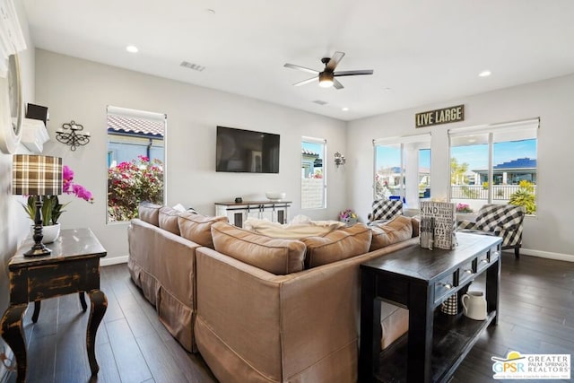 living room with dark hardwood / wood-style floors and ceiling fan