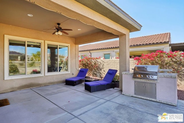 view of patio / terrace featuring ceiling fan, area for grilling, and a grill