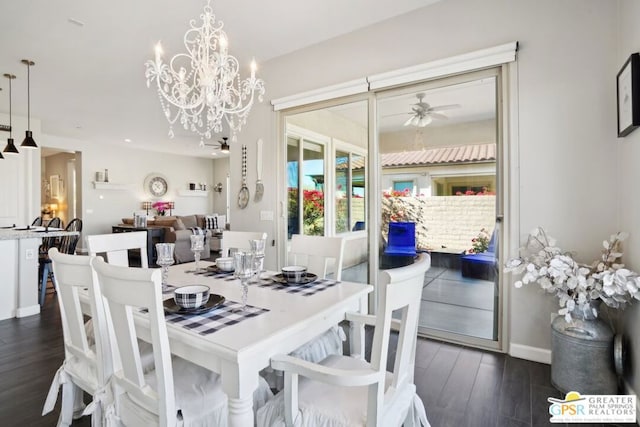 dining room with dark hardwood / wood-style floors and ceiling fan with notable chandelier