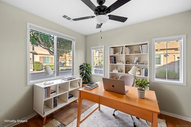 office space with ceiling fan and hardwood / wood-style floors