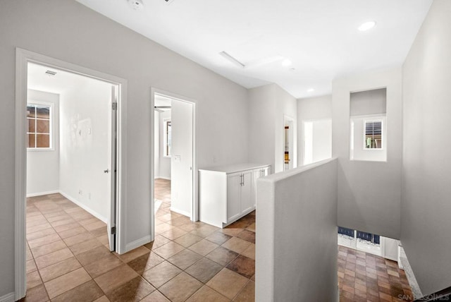 corridor with light tile patterned floors