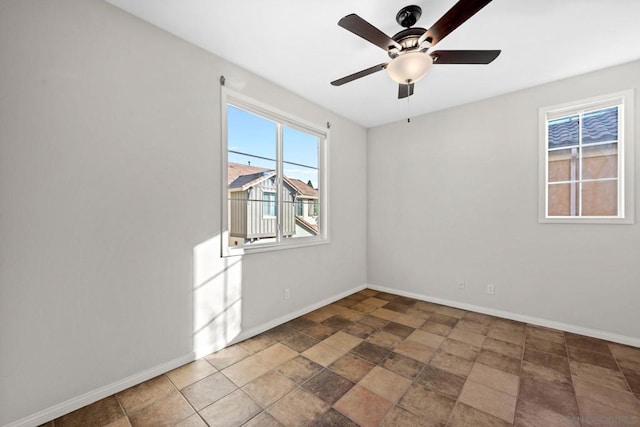 unfurnished room featuring ceiling fan