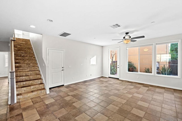 unfurnished living room with ceiling fan