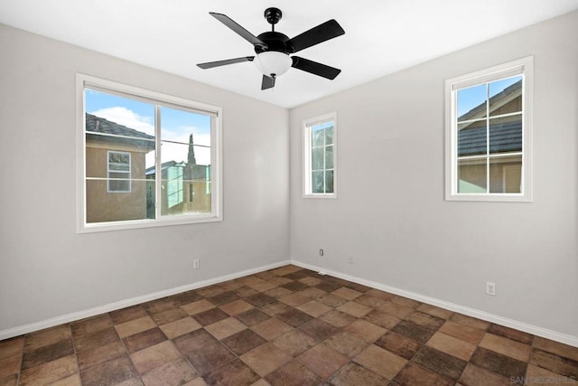 unfurnished room featuring ceiling fan