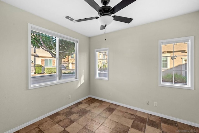 unfurnished room featuring ceiling fan