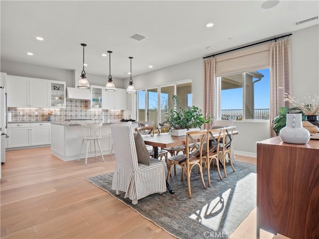 dining space featuring light hardwood / wood-style floors