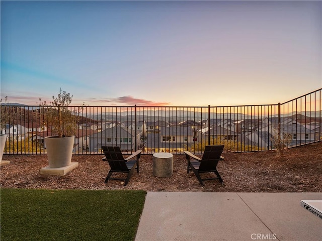 view of yard at dusk