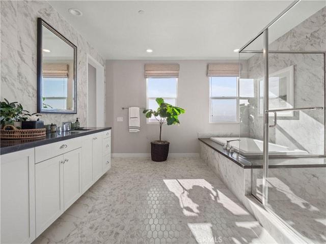 bathroom featuring vanity and plus walk in shower