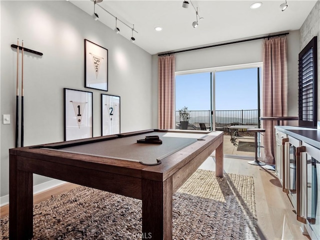 playroom featuring track lighting, light hardwood / wood-style floors, and billiards