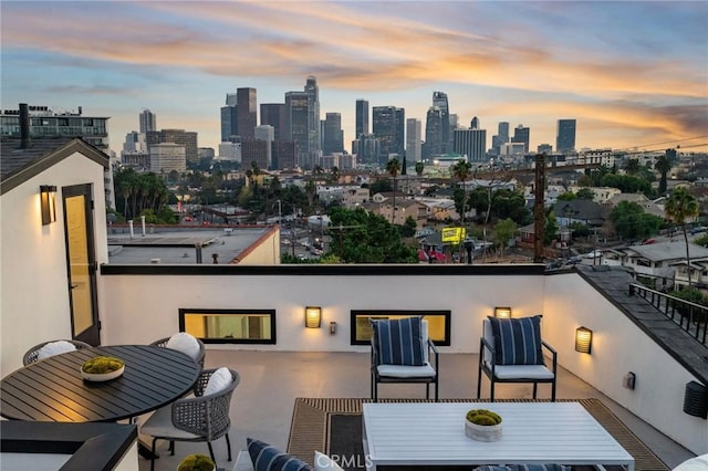 balcony at dusk with a patio area