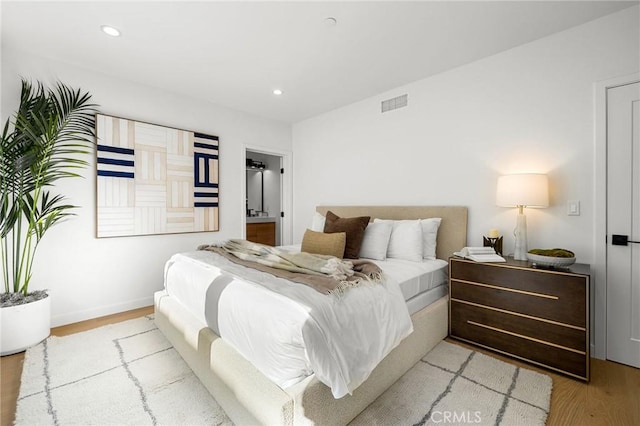 bedroom with light wood-type flooring