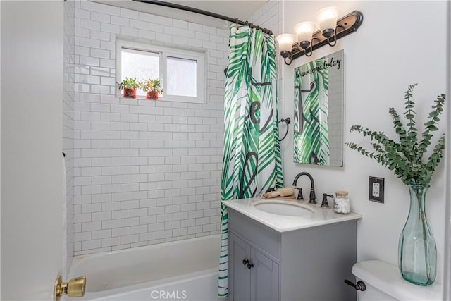 full bathroom featuring vanity, toilet, and shower / bath combo with shower curtain