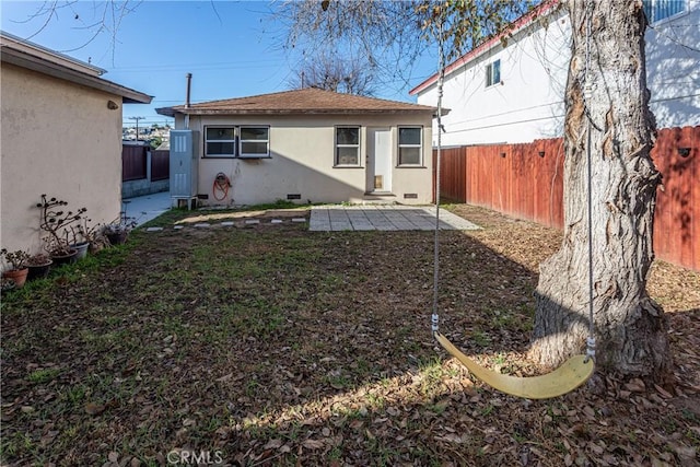 rear view of house with a patio