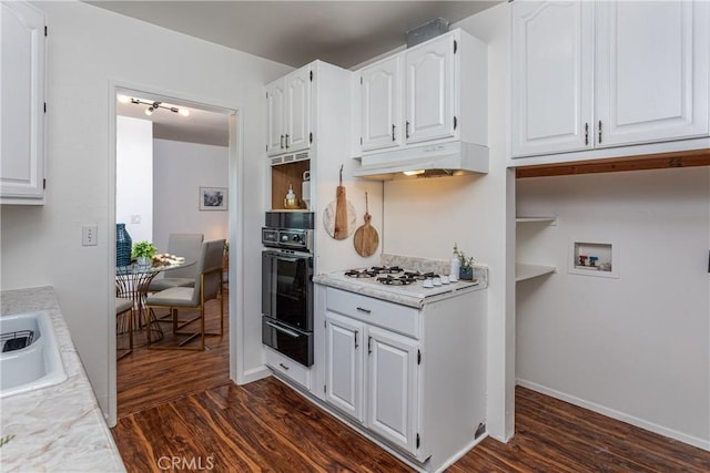 kitchen featuring white cabinetry, white gas cooktop, oven, and dark wood-type flooring