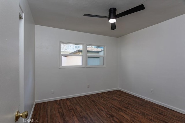 spare room featuring dark hardwood / wood-style floors and ceiling fan