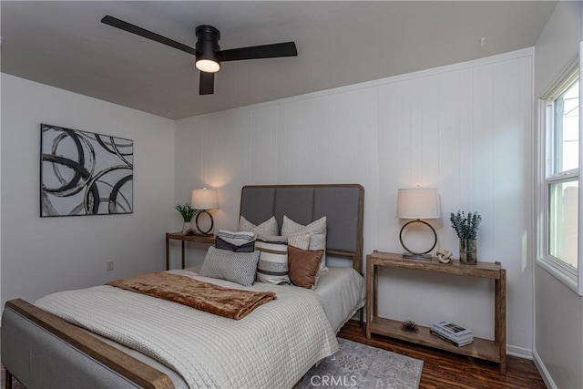 bedroom featuring dark wood-type flooring and ceiling fan