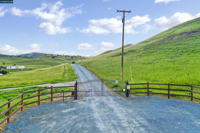 view of road with a mountain view and a rural view