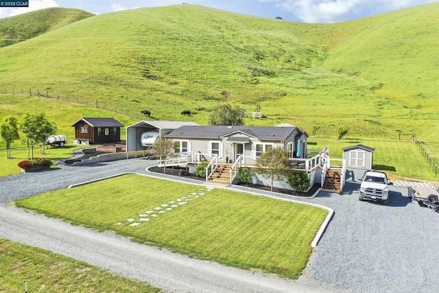 bird's eye view featuring a rural view and a mountain view