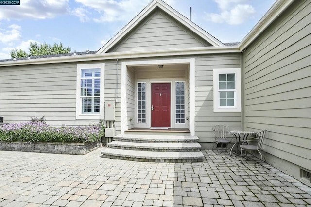 property entrance featuring a patio