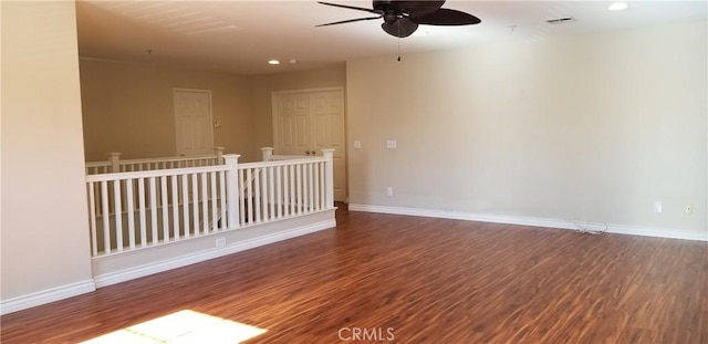 empty room with hardwood / wood-style flooring and ceiling fan