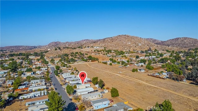 birds eye view of property featuring a mountain view