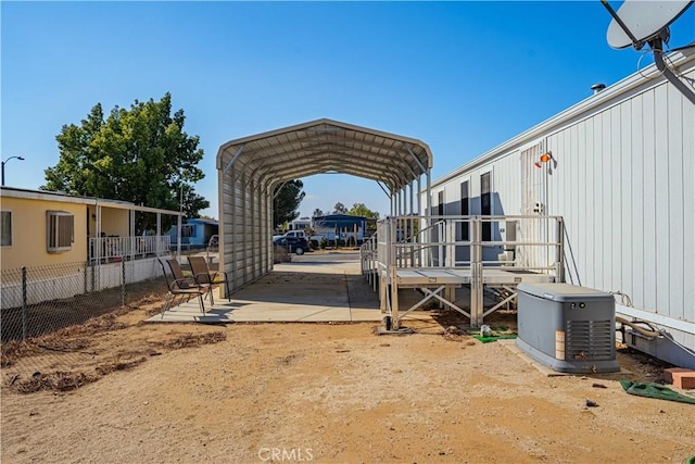 view of parking / parking lot with a carport