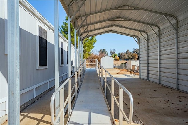 view of parking / parking lot featuring a carport