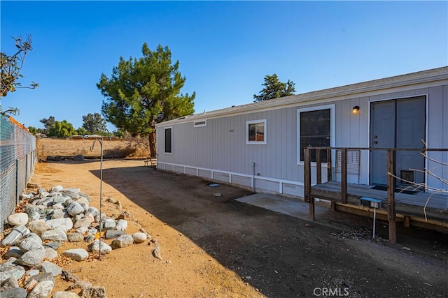 view of property exterior with a patio area