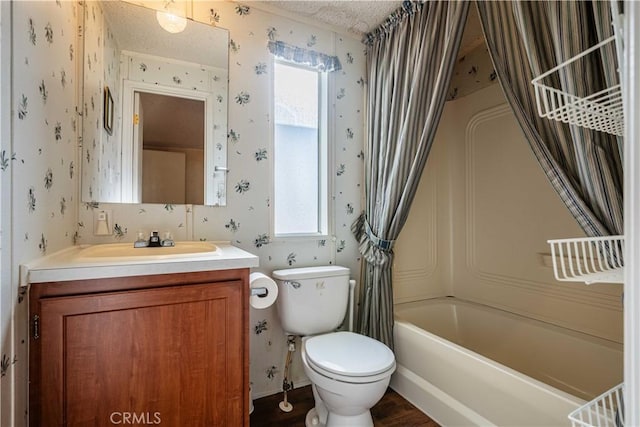 full bathroom featuring shower / tub combo with curtain, vanity, toilet, and a textured ceiling