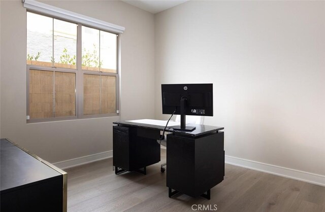 office space with light hardwood / wood-style flooring