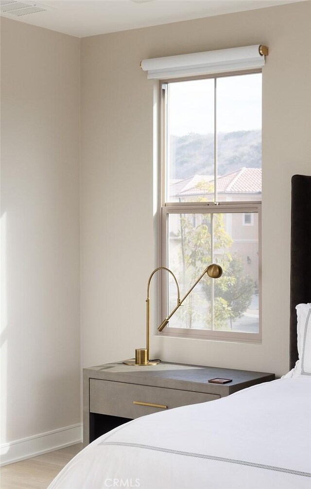 bedroom with light hardwood / wood-style flooring