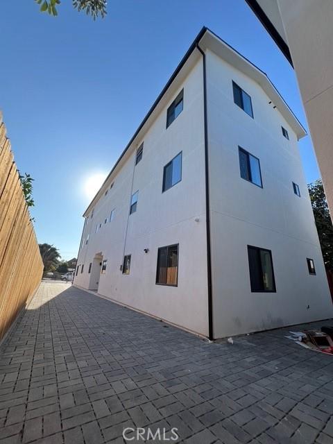 view of side of property with a patio