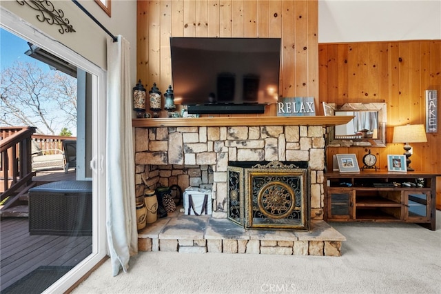 1430 Sequoia Dr, Lake Arrowhead, CA 92352 - living room with carpet, wood walls, and a stone fireplace