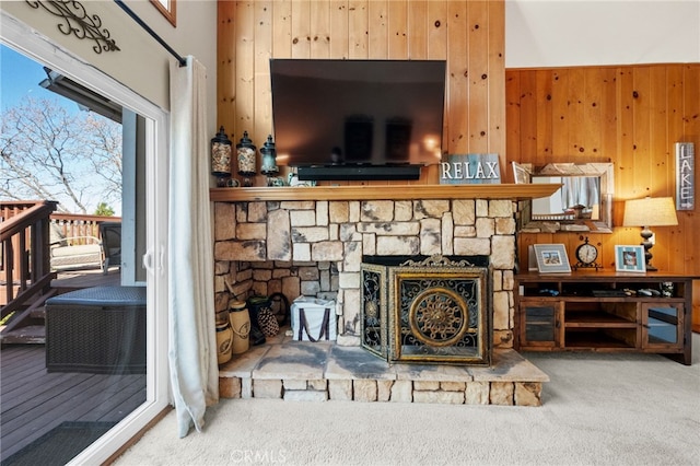 1430 Sequoia Dr, Lake Arrowhead, CA 92352 - carpeted living area featuring wood walls and a stone fireplace