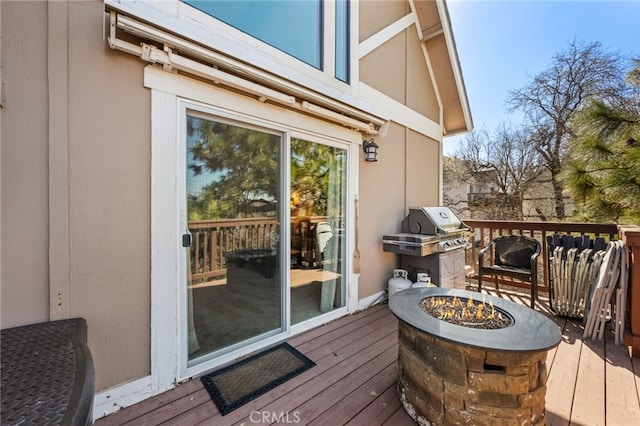 1430 Sequoia Dr, Lake Arrowhead, CA 92352 - wooden deck with an outdoor fire pit and area for grilling