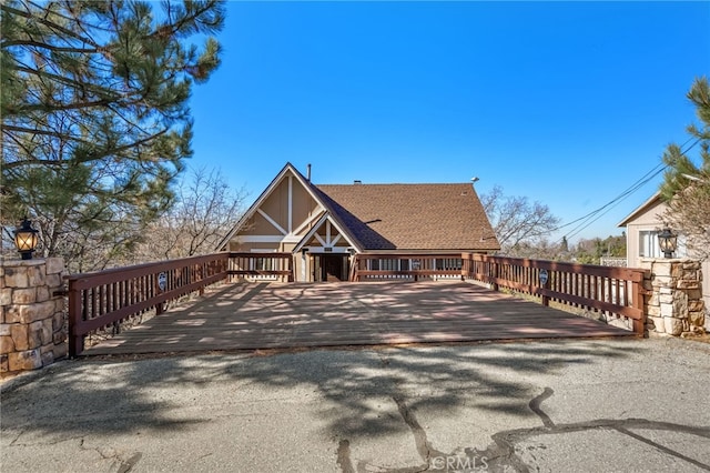 1430 Sequoia Dr, Lake Arrowhead, CA 92352 - view of front of property with a shingled roof and a deck