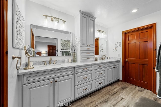 1430 Sequoia Dr, Lake Arrowhead, CA 92352 - full bathroom with double vanity, wood finished floors, and recessed lighting