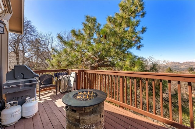 1430 Sequoia Dr, Lake Arrowhead, CA 92352 - wooden deck featuring a fire pit, area for grilling, and a mountain view