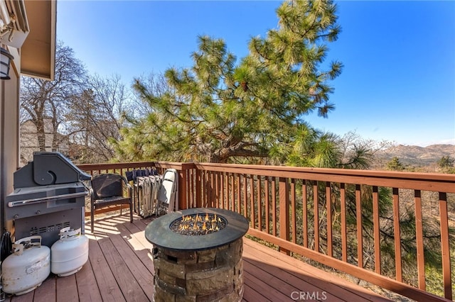 1430 Sequoia Dr, Lake Arrowhead, CA 92352 - wooden terrace with an outdoor fire pit, area for grilling, and a mountain view