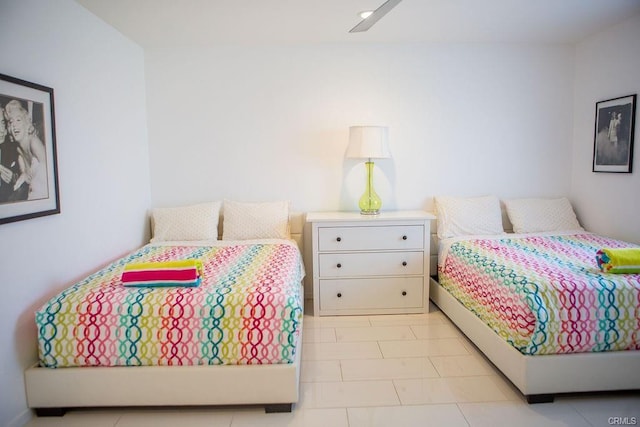 bedroom featuring light tile patterned floors