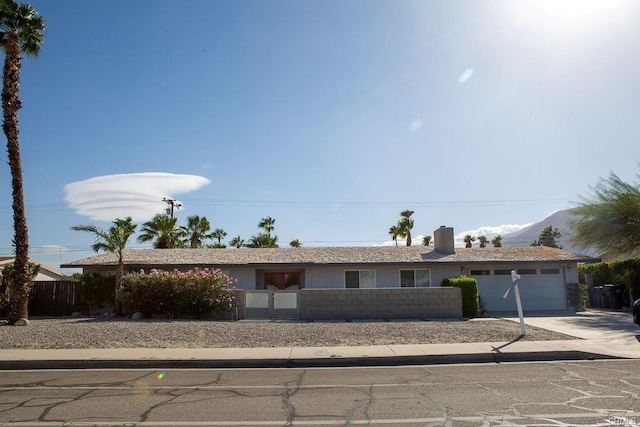 ranch-style house featuring a garage