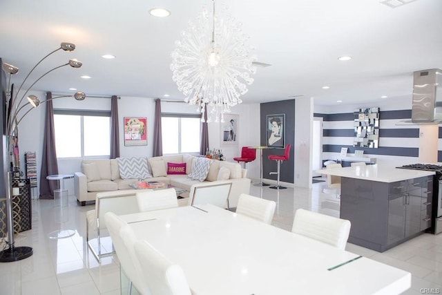 tiled dining area featuring an inviting chandelier