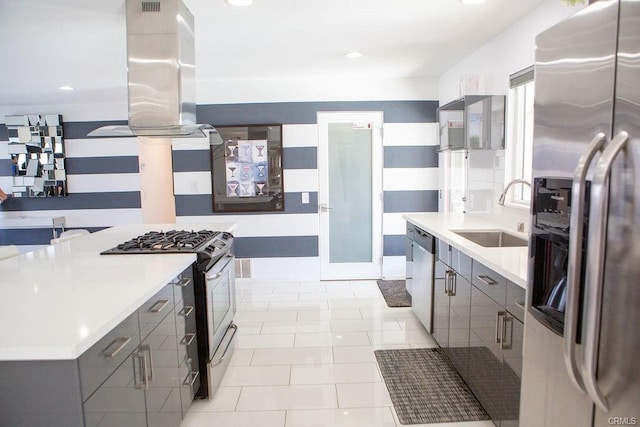 kitchen with appliances with stainless steel finishes, sink, gray cabinetry, island exhaust hood, and light tile patterned floors