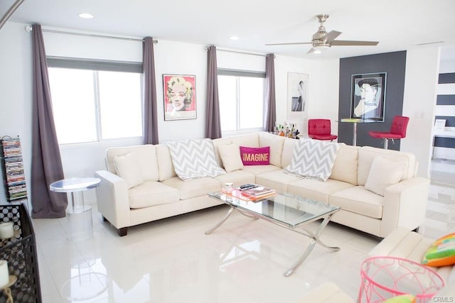 living room with light tile patterned flooring and ceiling fan