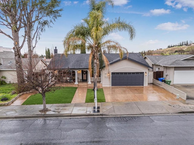 ranch-style home featuring a garage