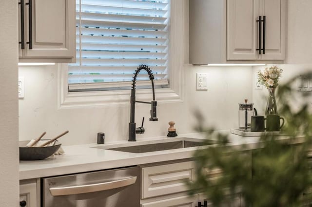 kitchen featuring dishwasher and sink